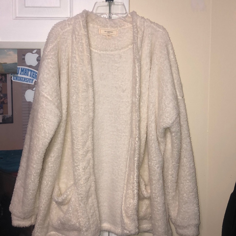 A white/eggshell fuzzy warm cardigan/cover
